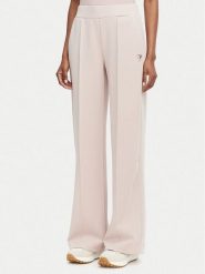 Guess Spodnie dresowe V6YB18 K4315 Różowy jasny Regular Fit. Czerwone spodnie sportowe Guess, z aplikacjami, z dresówki. Za 394.99 zł.
