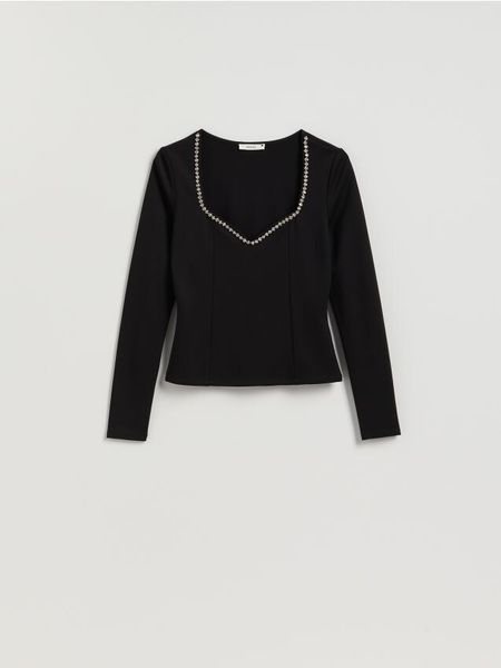 Bluzka z błyszczącą aplikacją - czarny. Czarne bluzki Reserved, l, z aplikacjami, z dzianiny, bez kołnierzyka, bez ramiączek. Za 89.99 zł.