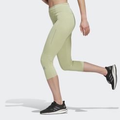 Legginsy damskie adidas 3/4 Own The Run Running. Zielone legginsy adidas, bez wzorów, z materiału, sportowe. W wyprzedaży za 145.55 zł.
