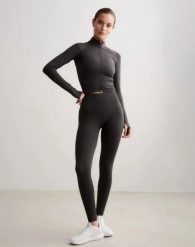 Damskie legginsy dłuższe, wysoki stan, invisible scrunch Shape Seamless szare. Szare legginsy AIM'N, bez wzorów, z dzianiny, długie. Za 301.00 zł.