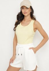 Żółty Top Bawełniany o Klasycznym Fasonie Emitiella. Żółte topy Born2be, m, bez wzorów, z bawełny, eleganckie, bez kołnierzyka, bez ramiączek. Za 29.99 zł.