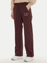 Champion Spodnie dresowe 117511 Brązowy Wide Leg. Brązowe spodnie dresowe Champion, bez wzorów, z dresówki. Za 209.99 zł.