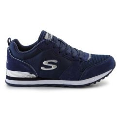 Buty sportowe Skechers Og 85 111-NVY niebieskie. Niebieskie buty treningowe bez wzorów, z materiału, bez zapięcia. Za 435.61 zł.