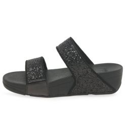 Kobiece klapki na koturnie FitFlop Lulu Slide. Czarne klapki FIT FLOP, bez wzorów, bez obcasa, na koturnie, bez zapięcia. Za 484.50 zł.