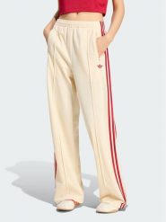 Adidas Spodnie dresowe Firebird Loose Tracksuit KS4671 Kremowy Loose Fit. Białe spodnie dresowe adidas, bez wzorów, z dresówki. Za 298.99 zł.