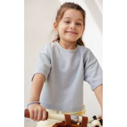 MINI bluzka w kolorze POWDER BLUE - DEMI. Niebieskie bluzki Marsala, bez wzorów, z bawełny, bez kołnierzyka, bez ramiączek. W wyprzedaży za 49.95 zł.