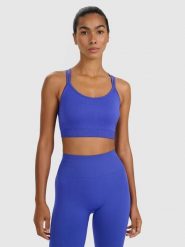 4F Biustonosz treningowy z niskim wsparciem - niebieski M/L. Niebieskie biustonosze sportowe 4f, bez wzorów, z elastanu, na fitness i siłownię. Za 119.99 zł.