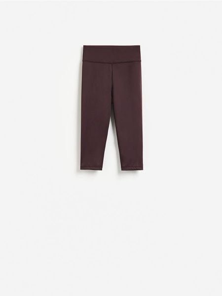 Legginsy capri - ciemnofioletowy. Fioletowe legginsy Reserved, bez wzorów, z dzianiny. Za 69.99 zł.