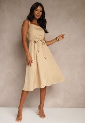 Beżowa Rozkloszowana Sukienka z Wiskozą w Paski Dolavessa. Brązowe sukienki Renee, na co dzień, l, bez wzorów, z wiskozy, eleganckie, bez kołnierzyka, bez ramiączek, midi, kopertowe. W wyprzedaży za 83.99 zł.