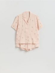 Dwuczęściowa piżama muślinowa - brzoskwiniowy. Pomarańczowe piżamy Reserved, l, bez wzorów, z bawełny, bez kołnierzyka, bez ramiączek. Za 129.99 zł.