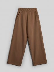 4F Szerokie spodnie dresowe damskie - beżowe S. Brązowe spodnie dresowe 4f, bez wzorów, z bawełny, krótkie, trekkingowe. Za 159.99 zł.