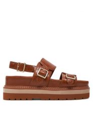 Clarks Sandały Orianna Glide 26176644 Brązowy. Brązowe sandały Clarks, bez wzorów, ze skóry, bez obcasa, na płaskiej podeszwie, bez zapięcia. Za 539.99 zł.