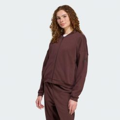 Kurtka Essentials Contemporary Logo Bomber. Brązowe kurtki adidas, bez wzorów, z materiału, bez kaptura. Za 279.00 zł.