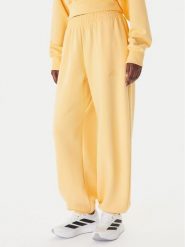 Adidas Spodnie dresowe Soft Lux KA7020 Pomarańczowy Loose Fit. Brązowe spodnie dresowe adidas, bez wzorów, z dresówki. Za 328.99 zł.