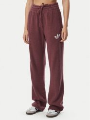 Adidas Spodnie dresowe Essentials IA4436 Bordowy Loose Fit. Czerwone spodnie dresowe adidas, bez wzorów, z dresówki. Za 298.99 zł.