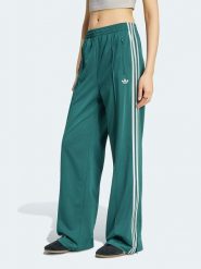 Adidas Spodnie dresowe w kolorze morskim rozmiar: XS. Zielone spodnie dresowe adidas, bez wzorów, z dresówki. Za 234.95 zł.