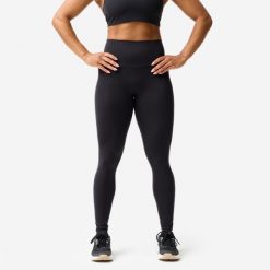Legginsy fitness damskie Domyos. Czarne legginsy DOMYOS, bez wzorów, z elastanu, sportowe. Za 129.99 zł.
