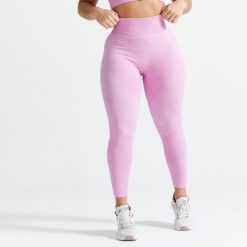 Legginsy fitness bezszwowe damskie Domyos 900. Czarne legginsy DOMYOS, bez wzorów, z elastanu, sportowe. Za 119.99 zł.