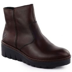 Skórzane botki damskie na koturnie brązowe Rieker X9165-27. Brązowe botki Rieker, bez wzorów, ze skóry, bez obcasa, na koturnie, bez zapięcia. Za 272.35 zł.