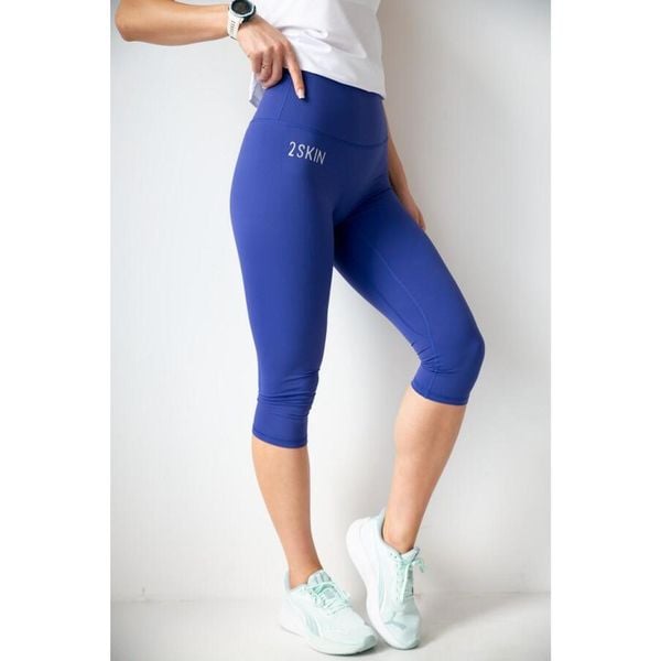 Legginsy 3/4 do biegania damskie 2skin Capris. Niebieskie legginsy 2SkIN, s, bez wzorów, z nylonu, do biegania. Za 169.00 zł.