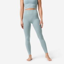 Legginsy do jogi i pilatesu damskie. Niebieskie legginsy Decathlon, bez wzorów, z elastanu, klasyczne, długie. Za 129.99 zł.