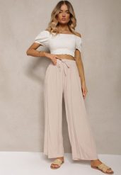 Jasnobeżowe Bawełniane Spodnie Palazzo High Waist z Gumką w Pasie Gitanea. Brązowe jeansy Renee, xl, bez wzorów, z bawełny, eleganckie, z podwyższonym stanem. W wyprzedaży za 26.99 zł.