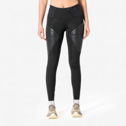 Legginsy do biegania damskie KIPRUN RHEON. Czarne legginsy KIPRUN, bez wzorów, z elastanu, długie. Za 299.99 zł.