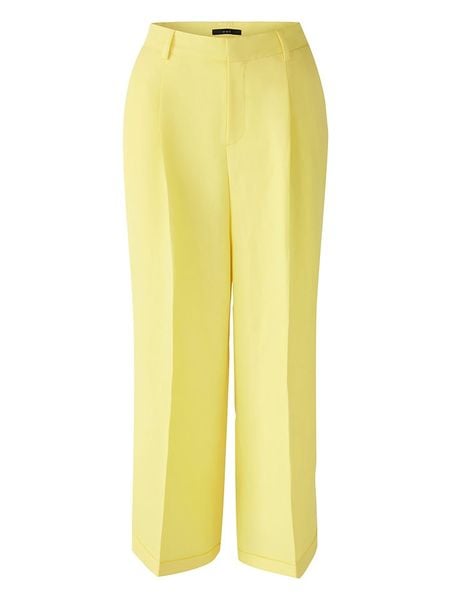 Oui Spodnie w kolorze żółtym rozmiar: 44. Żółte spodnie materiałowe Oui, bez wzorów, z materiału. Za 109.26 zł.