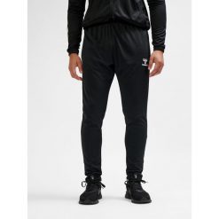 SPODNIE hmlESSENTIAL TRAINING PANTS. Czarne spodnie dresowe Hummel, bez wzorów, z dresówki. Za 100.00 zł.