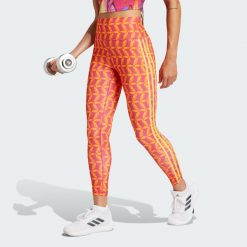 Legginsy adidas x FARM Rio 7/8. Czerwone legginsy adidas, bez wzorów, z materiału, sportowe. W wyprzedaży za 223.20 zł.