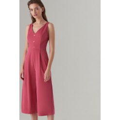Kombinezon na ramiączkach - Pomarańczo. Kombinezony marki Mohito. Za 129.99 zł.