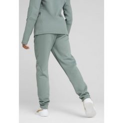 Damskie spodnie dresowe EVOSTRIPE PUMA Green Moon. Zielone spodnie dresowe Puma, bez wzorów, z dresówki. W wyprzedaży za 179.00 zł.