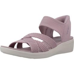 Sandały SKECHERS SLIP-INS ARYA Fioletowy. Fioletowe sandały Skechers, bez wzorów, z tkaniny, bez obcasa, bez zapięcia. Za 490.00 zł.