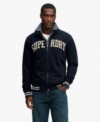 Superdry Vintage Athletic kurtka dresowa luźny krój. Niebieskie kurtki Superdry, xl, z aplikacjami, z bawełny, vintage, bez kaptura. Za 352.50 zł.