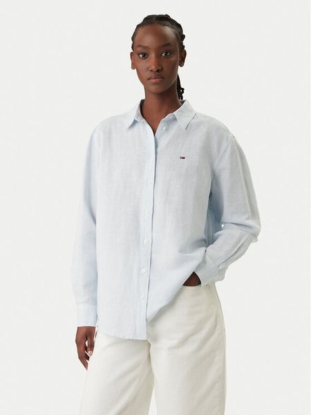 Tommy Jeans Koszula DW0DW22209 Błękitny Relaxed Fit. Niebieskie koszule Tommy Jeans, xxs, bez wzorów, z jeansu, bez kołnierzyka, bez ramiączek. Za 269.99 zł.