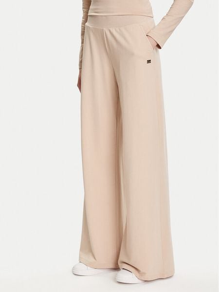 EA7 Emporio Armani Spodnie dresowe 7W000462 AF13135 U1046 Beżowy Relaxed Fit. Brązowe spodnie dresowe EA7 Emporio Armani, bez wzorów, z bawełny. Za 289.99 zł.