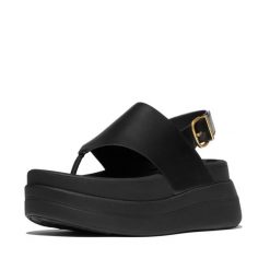 Kobiece sandały na koturnie ze skórzaną tylną paskiem FitFlop F-Mode. Czarne sandały FIT FLOP, bez wzorów, z materiału, eleganckie, bez obcasa, na koturnie, bez zapięcia. Za 610.50 zł.