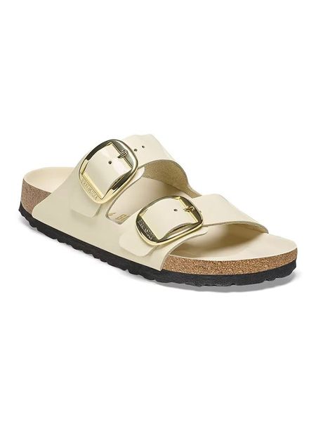 Birkenstock Skórzane klapki "Arizona" w kolorze kremowym rozmiar: 39. Brązowe klapki Birkenstock, bez wzorów, klasyczne, z otwartym noskiem, bez obcasa, bez zapięcia. Za 547.77 zł.