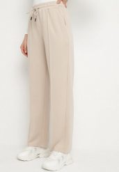 Beżowe Spodnie Dresowe z Wiskozą o Szerokim Kroju z Wysokim Stanem Setoria. Brązowe jeansy Born2be, bez wzorów, z dresówki, eleganckie, z podwyższonym stanem. Za 69.99 zł.
