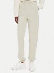 Calvin Klein Jeans Spodnie dresowe J20J224443 Beżowy Regular Fit. Brązowe spodnie dresowe Calvin Klein Jeans, bez wzorów, z bawełny. Za 219.99 zł.