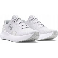 Buty sportowe dla kobiet UNDER ARMOUR UA CHARGED SURGE 4. Białe buty do biegania Under Armour, bez wzorów, z syntetyku, bez zapięcia, do biegania. W wyprzedaży za 183.93 zł.