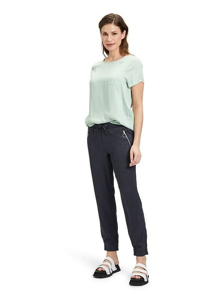 CARTOON Spodnie dresowe w kolorze granatowym rozmiar: 36. Niebieskie spodnie dresowe Cartoon, bez wzorów, z dresówki. Za 105.63 zł.