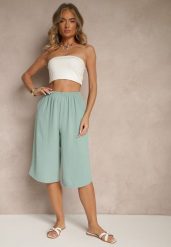 Jasnozielone Luźne Spodnie 3/4 z Kieszonkami Efrinea. Zielone jeansy Renee, bez wzorów, z gumy, eleganckie. W wyprzedaży za 31.99 zł.