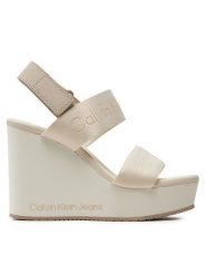 Calvin Klein Jeans Sandały Wedge Sandal Webbing In Mtl YW0YW01479 Écru. Sandały Calvin Klein Jeans, bez wzorów, z jeansu, bez obcasa, na koturnie, bez zapięcia. Za 459.99 zł.