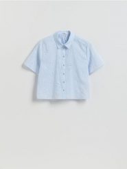 Ażurowa koszula - jasnoniebieski. Niebieskie koszule Reserved, l, w ażurowe wzory, z bawełny, bez kołnierzyka, bez ramiączek. Za 109.99 zł.