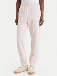 Lacoste Spodnie dresowe XF5244 Różowy jasny Regular Fit. Czerwone spodnie sportowe Lacoste, bez wzorów, z bawełny. Za 639.99 zł.