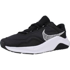 Tenisówki Nike Model Legend Essential 3 Wome Kolor Czarny. Czarne trampki Nike, bez wzorów, z gumy, sportowe, bez zapięcia. Za 504.00 zł.