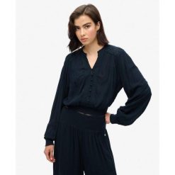 Bluzka z długim rękawem z marszczoną koronką. Niebieskie bielizna termoaktywna damska Superdry, bez wzorów, z koronki, bez ramiączek. Za 284.00 zł.
