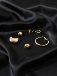 Kolczyki z błyszczącym wykończeniem 7 pack - złoty. Żółte kolczyki Sinsay, złote. Za 19.99 zł.