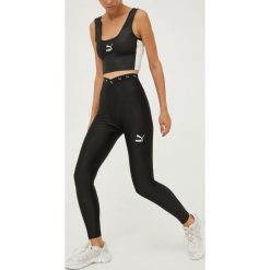 Puma legginsy treningowe Dare damskie kolor czarny gładkie. Czarne legginsy Puma, bez wzorów, z materiału. Za 229.99 zł.